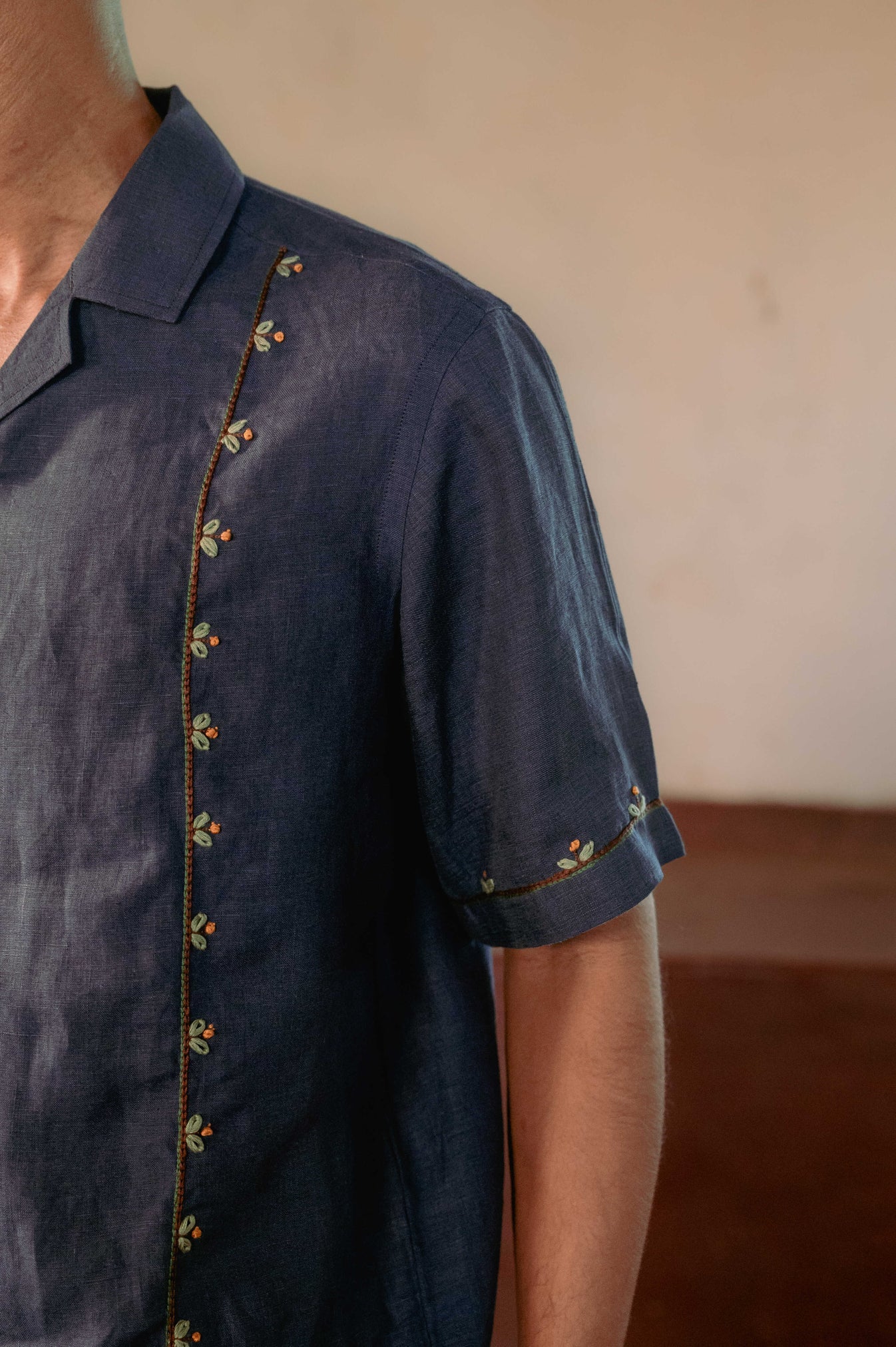 Buds in blue linen shirt