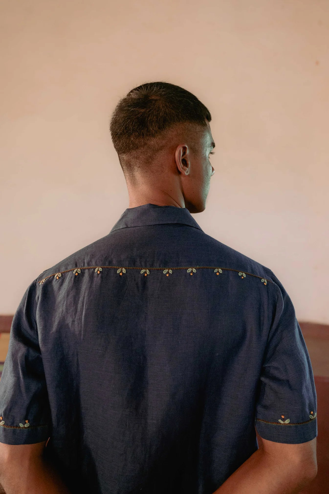 Buds in blue linen shirt