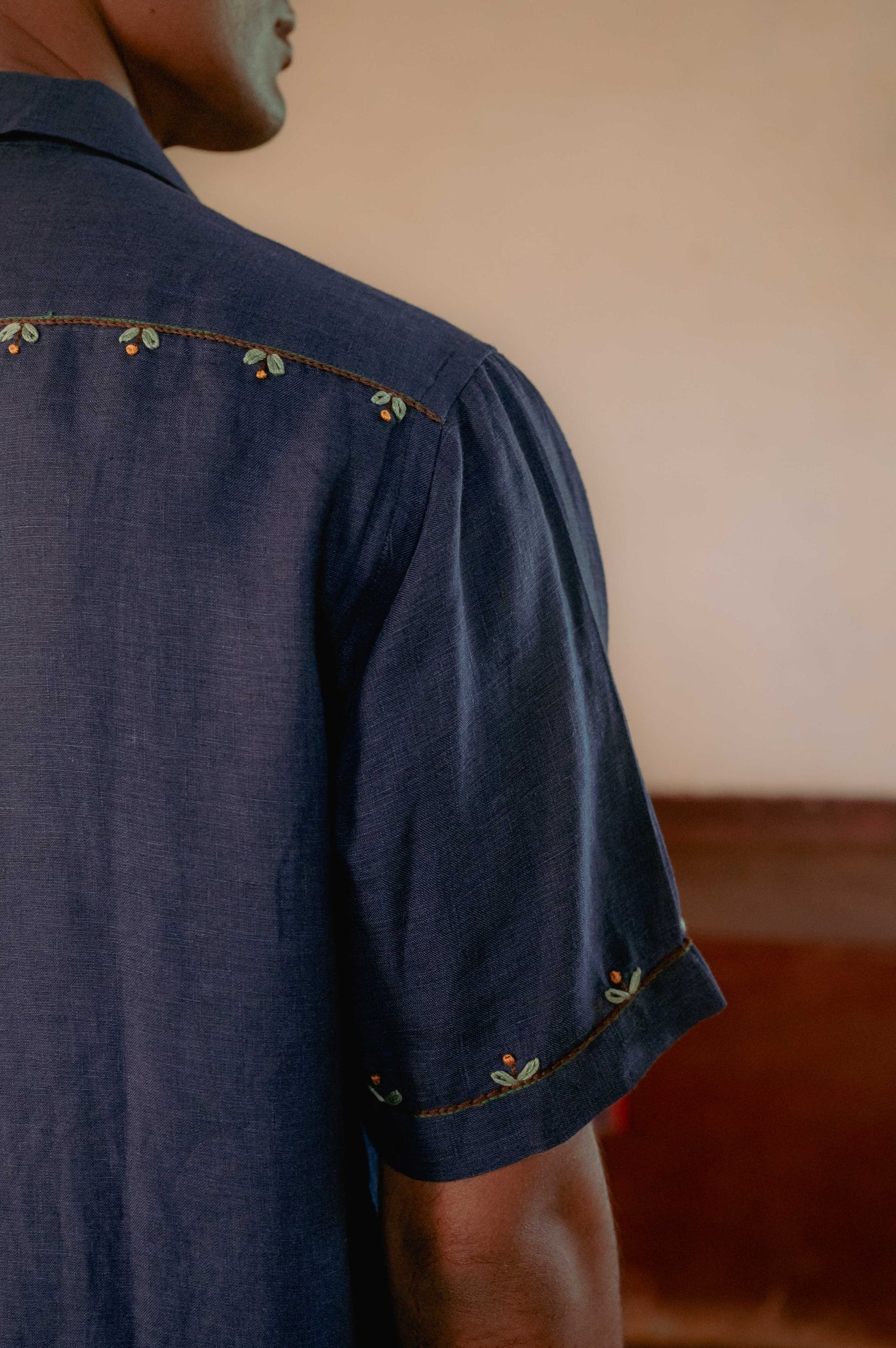 Buds in blue linen shirt