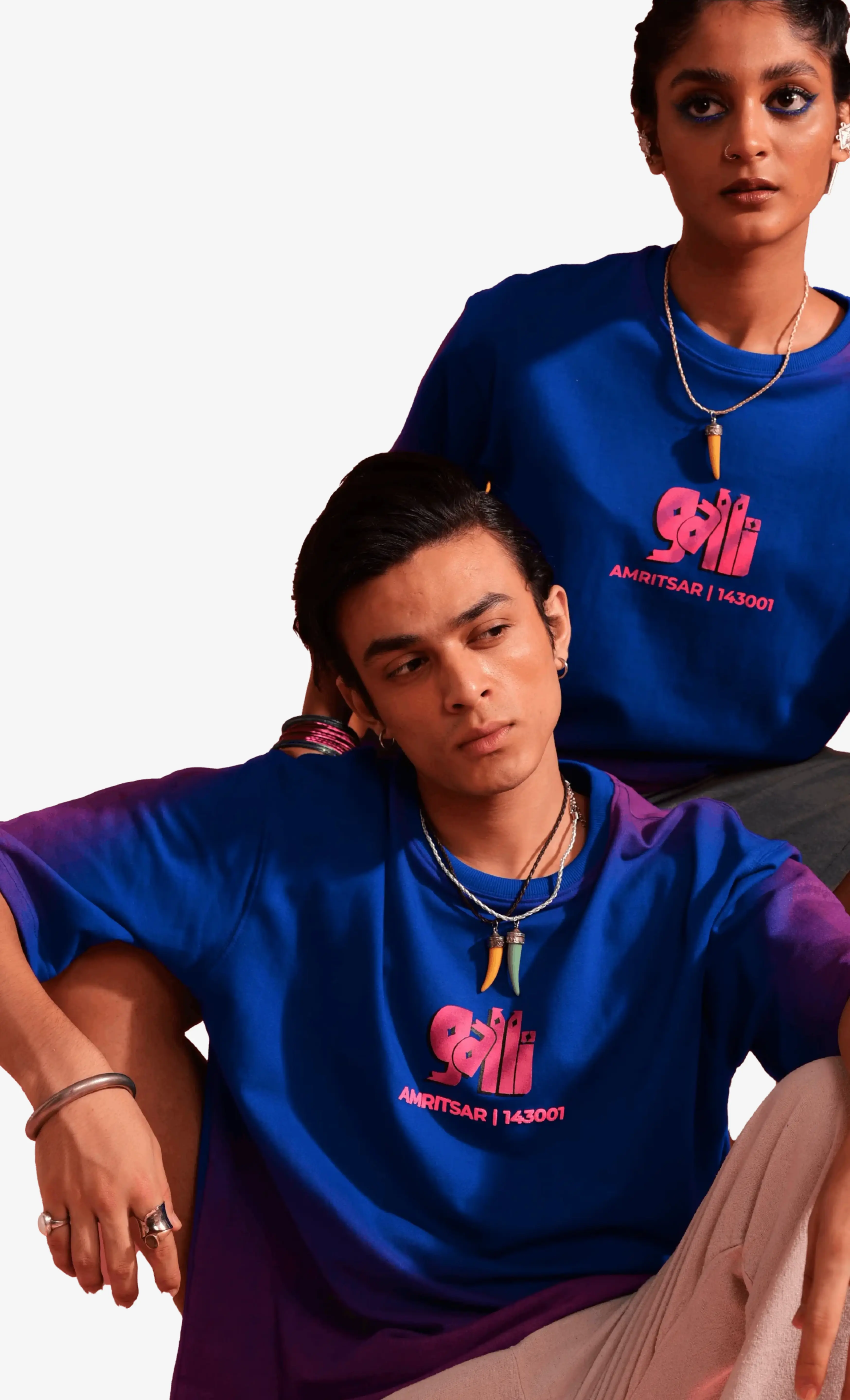 Two people wearing blue t-shirts with a logo and text on a white background – Sattva and Sage.