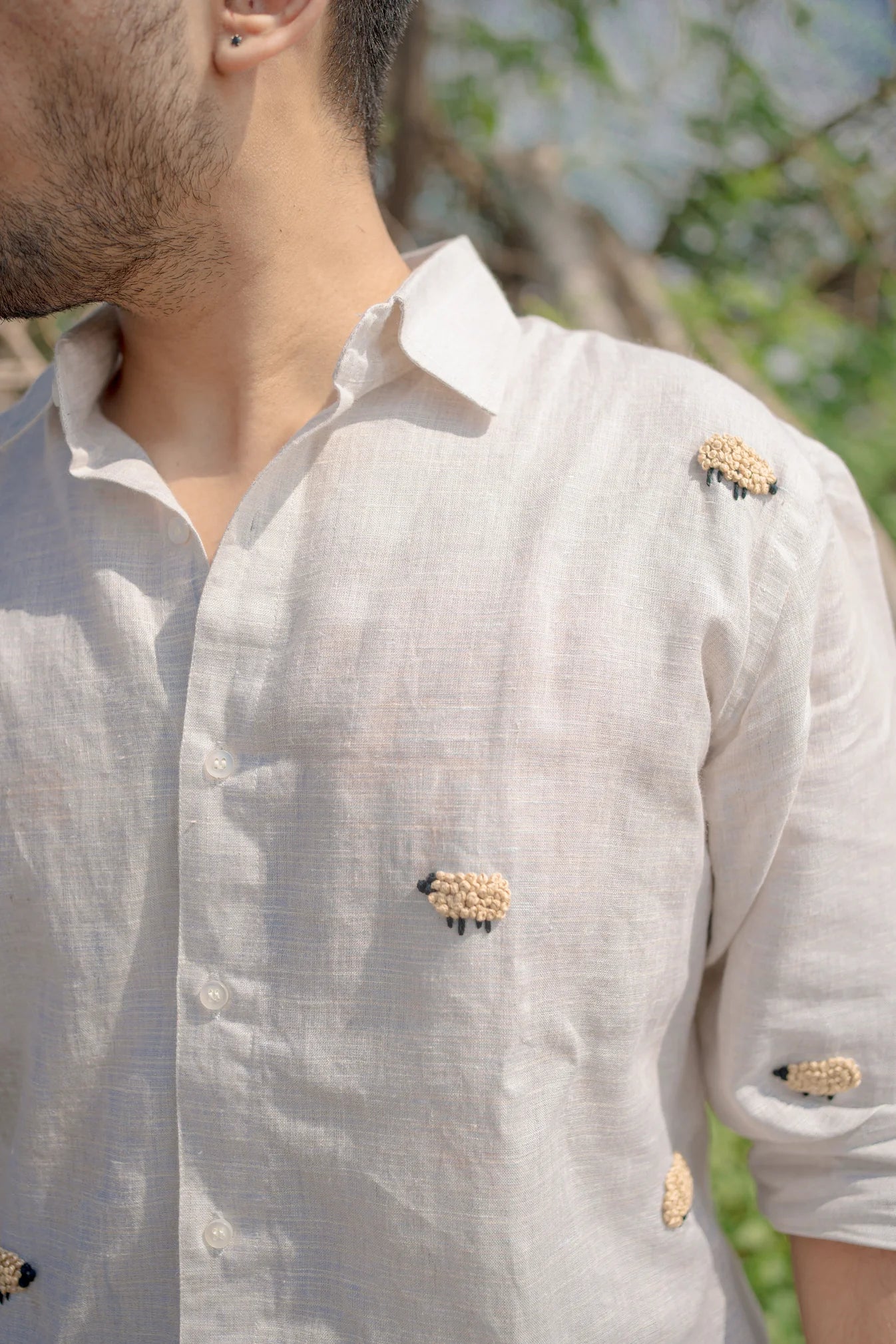 Black sheep shirt on beige linen